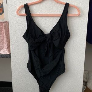 Cute one piece black bathing suit with open midriff